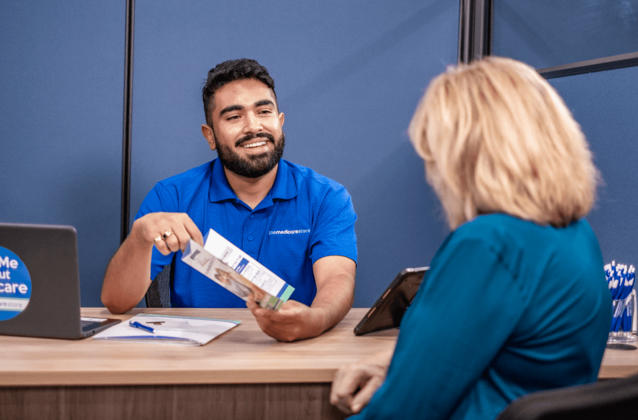 Jose, a licensed insurance agent at The Medicare Store in Reno, helping a client compare Medicare plans